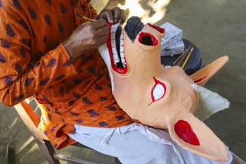 Artisan crafting the famous traditional masks of Majuli, Assam, India