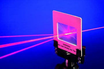 Red laser beam split by a diffraction grating Red laser beam split by a diffraction grating