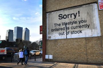 A stencil and spray paint artwork, by Banksy, East London, UK. It shows the message 'Sorry! The lifestyle you ordered is currently out of stock'. To illustrate that universities are increasingly deferring wage increases.
