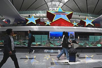 Passengers are seen at the Beijing Daxing International Airport in China's capital city. To illustrate the growing exodus of Chinese academics from US.