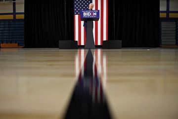 Joe Biden at a lectern Joe Biden at a lectern