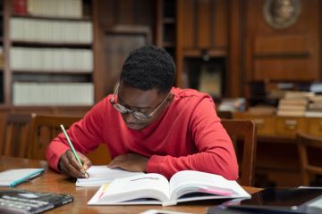 A black student studies in a university library
