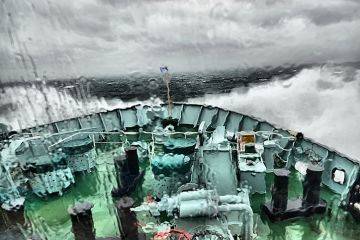 A boat in a storm, representing academic freedom