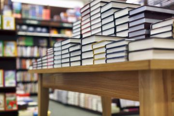 Books on a display table in a bookshop Books on a display table in a bookshop