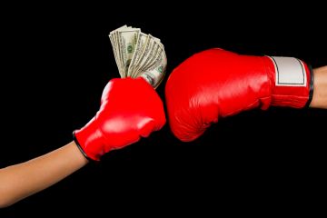 Boxing gloves and money Boxing gloves and money