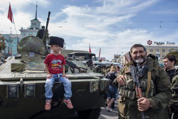 Boy sitting on armoured personnel carrier, Luhansk, Ukraine, 2014 Boy sitting on armoured personnel carrier, Luhansk, Ukraine, 2014