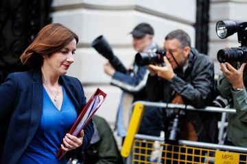 Bridget Phillipson walking past a group of photographers. To illustrate that cool heads are needed by ministers when considering considering further regulation of university franchise partnerships, which are under the spotlight.