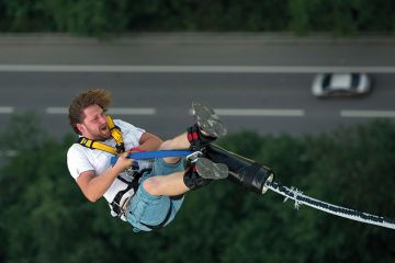 man bungee jumping