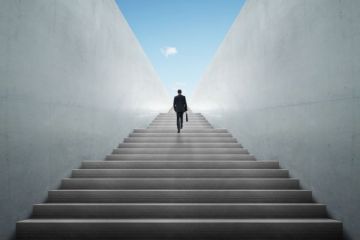 Businessman climbing stairs
