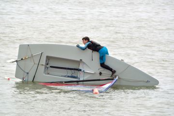 Capsized Sailing Dinghy Capsized Sailing Dinghy
