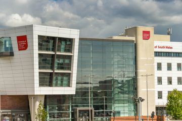 Cardiff, Wales - June 2019 Sign on the outside of the media department of the University of South Wales campus building in Cardiff city centre