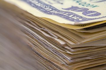 A pile of $100 dollar bills A pile of $100 dollar bills