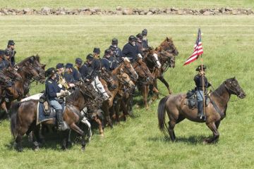 A lone cavalryman backed by numerous others A lone cavalryman backed by numerous others