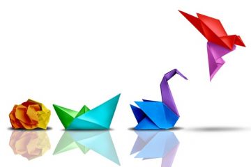 A ball of paper turns into an origami bird A ball of paper turns into an origami bird, illustrating successful change