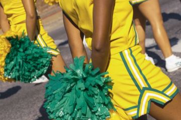 Cheerleaders marching in a parade in New Orleans, United States of America. Cheerleaders marching in a parade in New Orleans, United States of America.