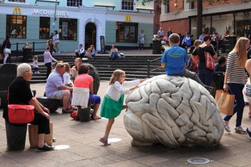 Children climbing on sculpture by-Anne and Patrick Poirier, Norwich, Norfolk Children climbing on sculpture by-Anne and Patrick Poirier, Norwich, Norfolk