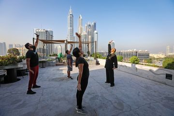 Instructor teaching Chinese martial arts on roof of building in Dubai Instructor teaching Chinese martial arts on roof of building in Dubai