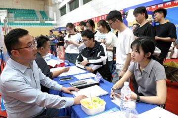 Students queue up at a job fair in China Students queue up at a job fair in China