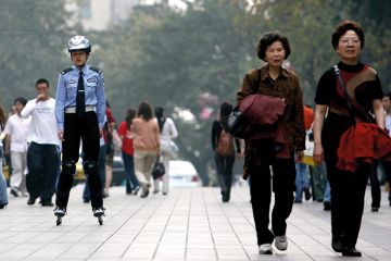 Chinese police officer on rollerblades Chinese police officer on rollerblades