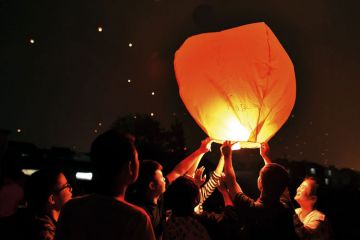 Chinese students releasing paper lanterns Chinese students releasing paper lanterns