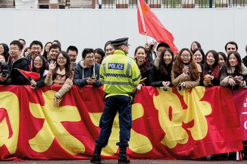Chinese students show support for Chinese President Xi Jinping as he arrives to tour the National Graphene Institute at Manchester University in 2015 Chinese students show support for Chinese President Xi Jinping as he arrives to tour the National Graphene Institute at Manchester University in 2015