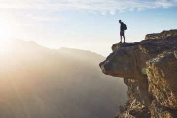 A man looks over the edge of a cliff, illustrating the drop-off in ERC funder in mid-career A man looks over the edge of a cliff, illustrating the drop-off in ERC funder in mid-career