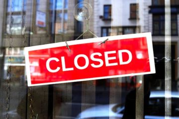 A closed sign on a door A closed sign on a door