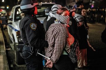 Members of the NYPD detain protesters from the pro-Palestinian protest encampment and Hamilton Hall, Columbia University where demonstrators barricaded themselves inside on April 30, 2024 in New York City