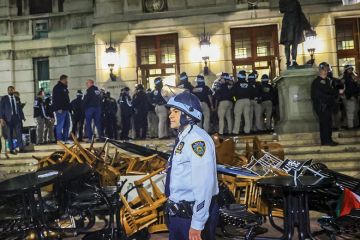 New York Police Department officers detain dozens of pro-Palestinian students at Columbia University after they barricaded themselves at the Hamilton Hall building near Gaza Solidarity Encampment earlier in New York, United States on April 30, 2024