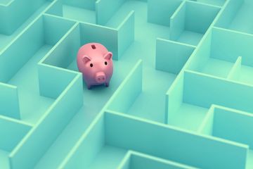 A piggy bank in a maze, illustrating financial confusion A piggy bank in a maze, illustrating financial confusion