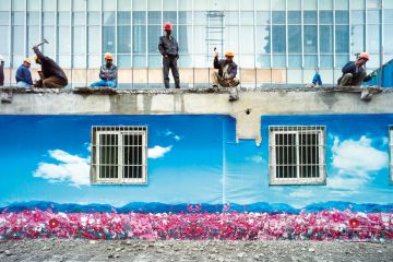 Construction crew dismantle a building, Shanghai, China Construction crew dismantle a building, Shanghai, China