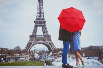 Couple kissing near Eiffel Tower, Paris Couple kissing near Eiffel Tower illustrating a story about the court case over University of Paris name