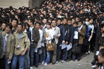 Crowd of graduates waiting for job fair, China