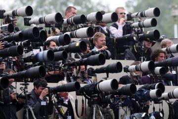 Crowd of press photographers aiming cameras Crowd of press photographers aiming cameras