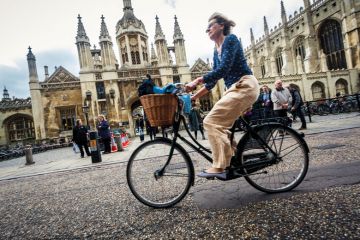 Cyclist outside University of Cambridge Cyclist outside University of Cambridge