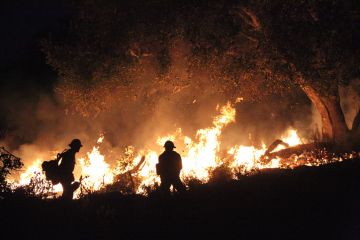 December 11, 2017 - Fire crews, using controlled burns, create a barrier in the foothills of Carpinteria, California, in the hopes of containing the Thomas fire in Southern California.