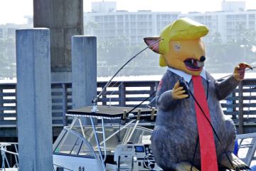 December 29, 2018, Lake Worth, Florida, USA. An inflatable balloon resembling President Trump is located on a boat who opposes the President.