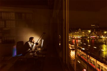 Man working late at night Man working late at night