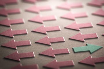 One arrow pointing away from all the other arrows One arrow pointing away from all the other arrows