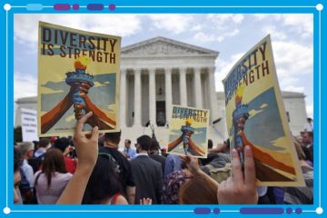 People holding placards stating "Diversity is Strength" outside the US Supreme Court, Washington DC People holding placards stating "Diversity is Strength" outside the US Supreme Court, Washington DC