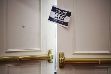 A 'Do Not Enter' sign is displayed on a door at a South Carolina primary night rally for Donald Trump. To illustrate Trump's ban on paying open access fees. A 'Do Not Enter' sign is displayed on a door at a South Carolina primary night rally for Donald Trump. To illustrate Trump's ban on paying open access fees.