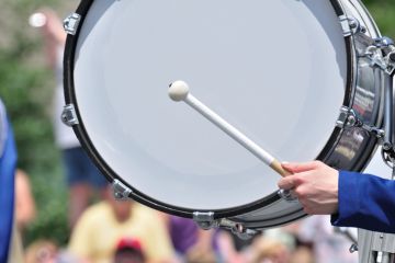 Drummer Playing Bass Drum in Parade Drummer Playing Bass Drum in Parade