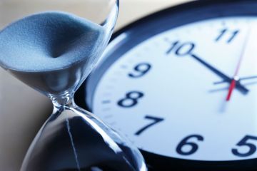 Egg timer and clock showing deadlines