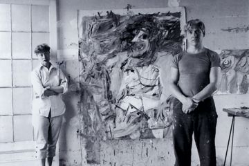 Elaine and Willem de Kooning standing in front of painting