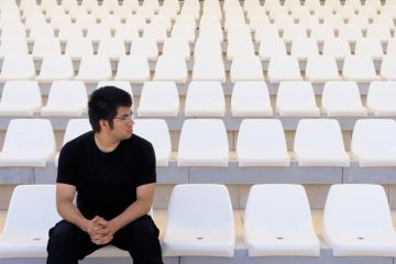 Man in empty stadium Man in empty stadium