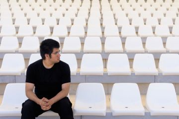 Man in empty stadium
