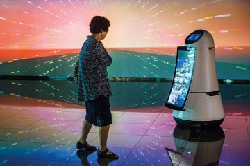 Woman looking at robot Woman looking at robot