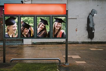 female graduates man turning away female graduates man turning away