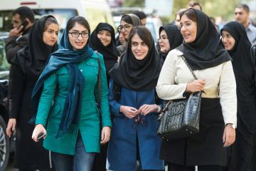 Female students walking on campus, University of Tehran, Iran