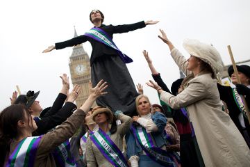 Feminists dressed as The Suffragettes at a protest for women's rights in London. One is standing on the others. To illustrate how a boycott of a feminist title failed to consider its likely impact on early career researchers Feminists dressed as The Suffragettes at a protest for women's rights in London. One is standing on the others. To illustrate how a boycott of a feminist title failed to consider its likely impact on early career researchers